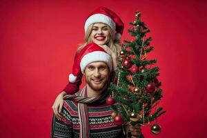 woman next to man family portrait christmas tree decoration holiday photo