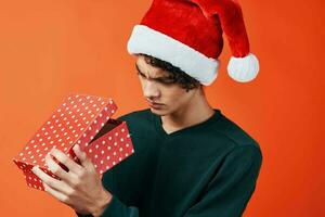 guy in santa hat gift christmas new year holiday photo