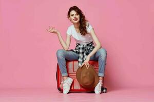 woman with red suitcase tourism lifestyle destination photo