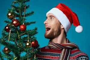 handsome man in New Year's clothes decoration christmas studio posing photo