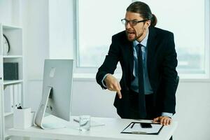 office worker in the office gestures with his hands executive photo