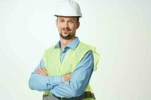 Male builder Professional working uniform light background photo