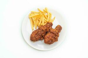 spicy Korean fried chicken with french fries photo
