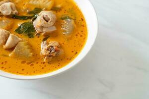 Chicken curry soup with roti photo