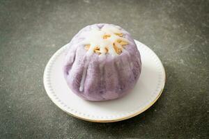 taro bun with white sugar cream and nut photo