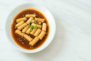 Spicy Jjajang Tteokbokki or Korean rice cake in spicy black bean sauce photo