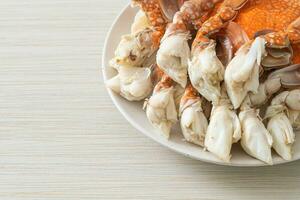 Steamed blue crab with spicy seafood sauce photo