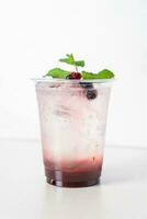 mix berry with soda in glass photo