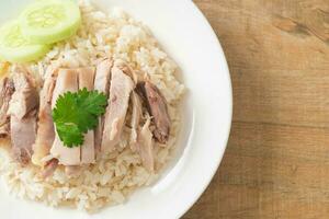 Hainanese Chicken Rice or steamed rice with chicken photo