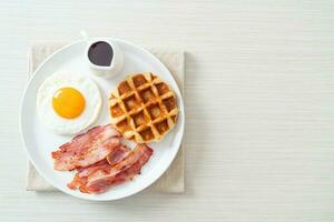 fried egg with bacon and waffle photo