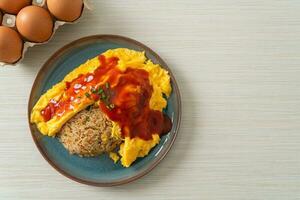 Flavored Fried Rice in an Omelet Wrapping photo