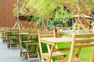 wood table and chair in outdoor coffee shop cafe and restaurant photo