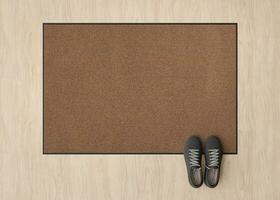 Blank brown door mat on the floor at home. Welcome mat with copy space for your text. Doormat mock up. Carpet at entrance for wiping dirty shoes. Mockup. 3D Rendering. photo