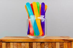 Colorful sticks in glass bottles combination of colors Relationship concept, heterosexual, sexual diversity, transgender, LGBTQ photo