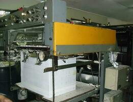 machines on a large printing plant factory, printing of books photo