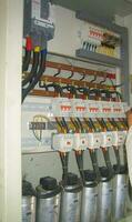 Voltage switchboard panel, electrical components at plant and factory with circuit breakers. photo