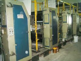 machines on a large printing plant factory, printing of books photo
