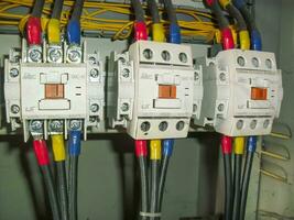 Voltage switchboard panel, electrical components at plant and factory with circuit breakers. photo