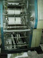 machines on a large printing plant factory, printing of books photo