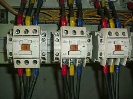 Voltage switchboard panel, electrical components at plant and factory with circuit breakers. photo