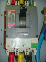 Voltage switchboard panel, electrical components at plant and factory with circuit breakers. photo