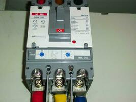 Voltage switchboard panel, electrical components at plant and factory with circuit breakers. photo