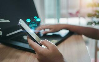 People are working and bringing AI to help them work on computers and smartphone. photo