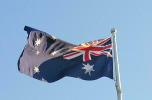 Waving Australia National Flag in windy day photo