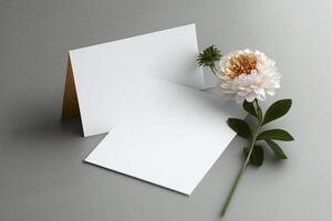 white chamomile flowers and envelope on a grey background, photo