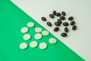 Many different tablet pills on color background, flat lay, with copy space. photo