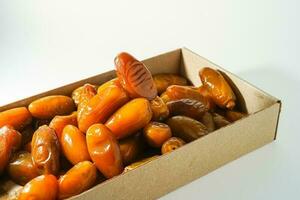 Fresh ripe yellow dates, fresh dates ruthob isolated on white background photo