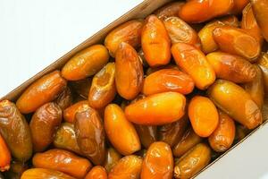 Fresh ripe yellow dates, fresh dates ruthob isolated on white background photo