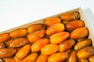 Fresh ripe yellow dates, fresh dates ruthob isolated on white background photo