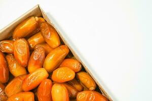 Fresh ripe yellow dates, fresh dates ruthob isolated on white background photo