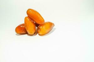 Fresh ripe yellow dates, fresh dates ruthob isolated on white background photo