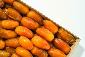 Fresh ripe yellow dates, fresh dates ruthob isolated on white background photo
