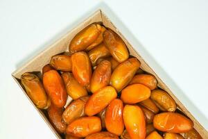 Fresh ripe yellow dates, fresh dates ruthob isolated on white background photo