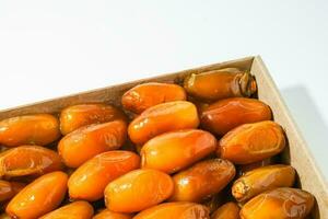 Fresh ripe yellow dates, fresh dates ruthob isolated on white background photo