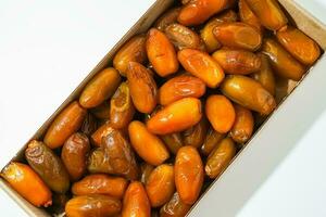 Fresh ripe yellow dates, fresh dates ruthob isolated on white background photo