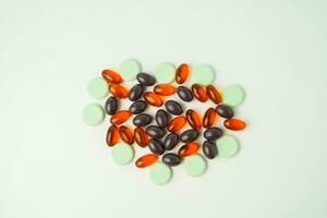 Many different tablet pills on white background, flat lay, with copy space. photo