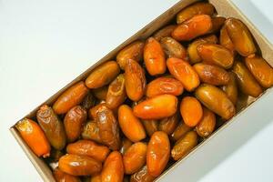 Fresh ripe yellow dates, fresh dates ruthob isolated on white background photo