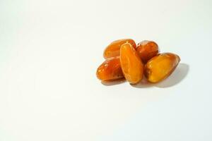 Fresh ripe yellow dates, fresh dates ruthob isolated on white background photo