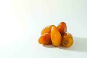 Fresh ripe yellow dates, fresh dates ruthob isolated on white background photo