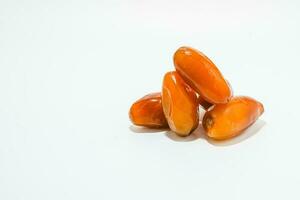 Fresh ripe yellow dates, fresh dates ruthob isolated on white background photo