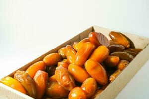 Fresh ripe yellow dates, fresh dates ruthob isolated on white background photo
