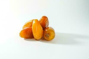 Fresh ripe yellow dates, fresh dates ruthob isolated on white background photo