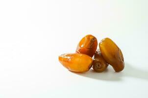 Fresh ripe yellow dates, fresh dates ruthob isolated on white background photo