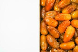 Fresh ripe yellow dates, fresh dates ruthob isolated on white background photo