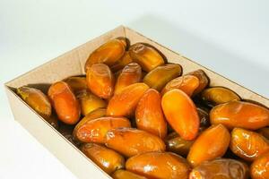 Fresh ripe yellow dates, fresh dates ruthob isolated on white background photo