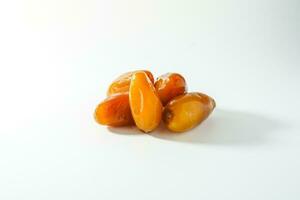 Fresh ripe yellow dates, fresh dates ruthob isolated on white background photo